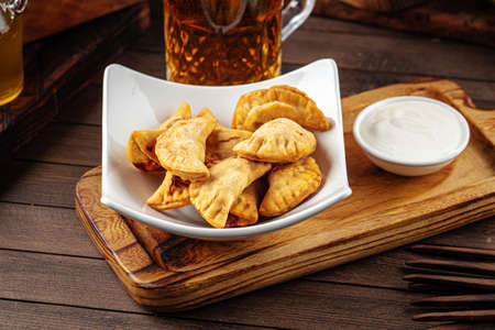 Plate of fried cheburek meat stuffed pies