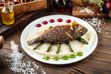 Dish of gourmet grilled dorada fish