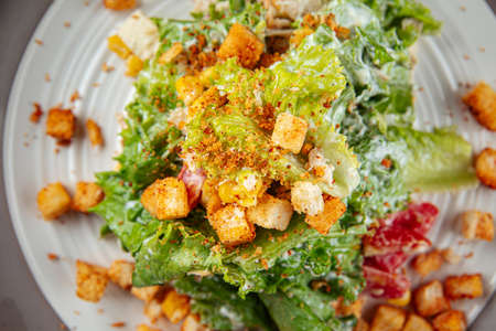 Russian malibu salad with croutons and hamの写真素材