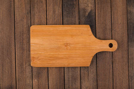 Light brown wooden cutting board