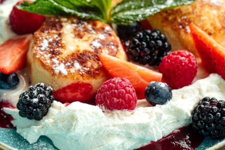 Closeup on cottage cheese pancakes with berriesの写真素材