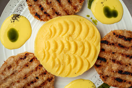 Portion of chicken cutlets with mashed potatoesの写真素材