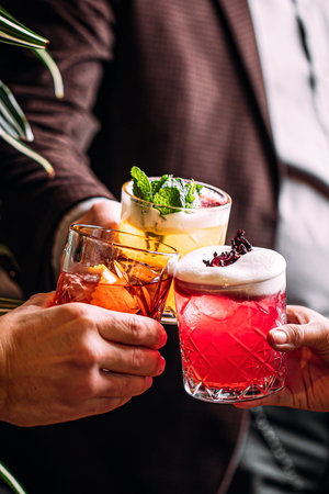 People cling with different cocktail glasses