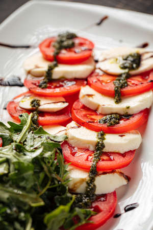 Italian caprese salad with mozzarella and tomatoesの写真素材