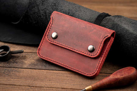 Side view on hand crafted red leather wallet