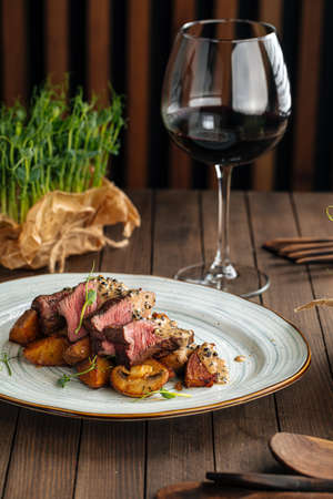 Beef medallions dish with potatoes and mushroomsの写真素材