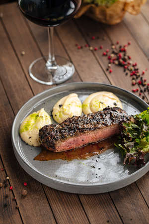 Beef pepper steak with celery puree dishの写真素材