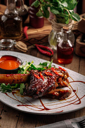 Gourmet cooked lamb shank with red sauceの写真素材