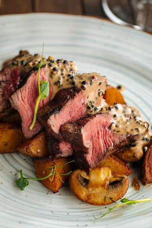 Beef medallions dish with potatoes and mushroomsの写真素材