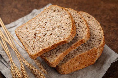 Fresh baked sliced loaf of rye bread