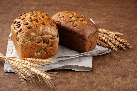 Fresh baked loaves of bread with pumpkin seeds