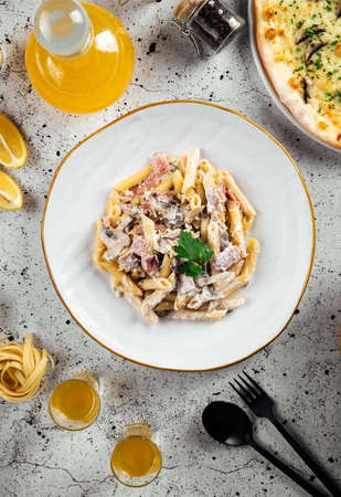 Italian pasta with ham and mushroomsの写真素材