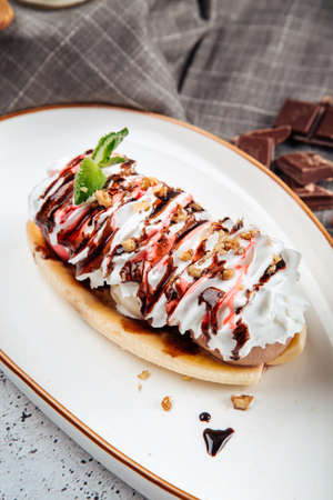 Banana split dessert with nutsの写真素材