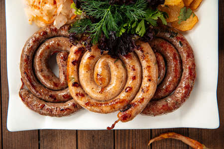 Assorted grilled sausages with sauerkrautの写真素材