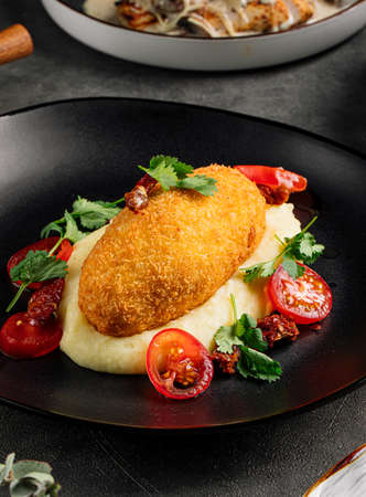 Chicken kiev cutlet with mashed potatoの写真素材