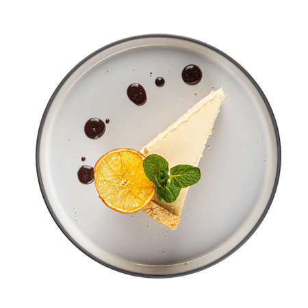 Isolated portion of cheesecake slice