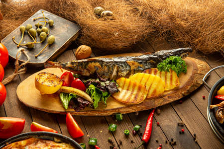 Grilled mackerel fish with potatoesの写真素材