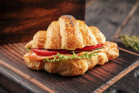 Closeup on croissant sandwich with salmon