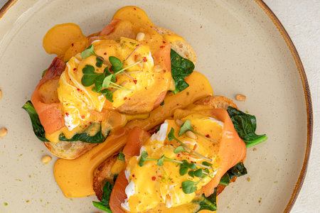 Portion of eggs benedict toast with salmonの写真素材