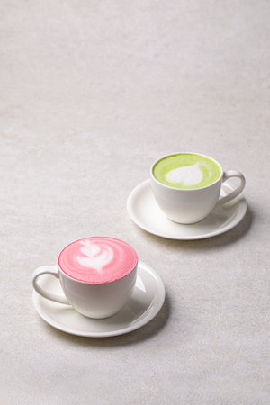 Two cups of different matcha latte drinksの写真素材