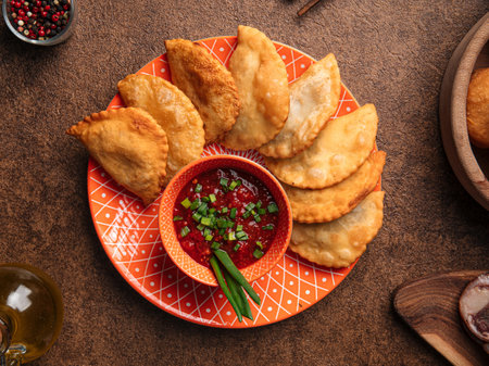 Oriental meat stuffed pies chebureks with sauceの写真素材