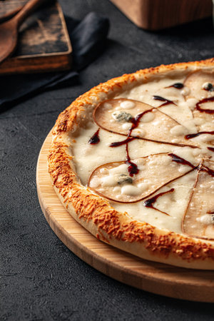 Gourmet pizza with pear and gorgonzola cheeseの写真素材