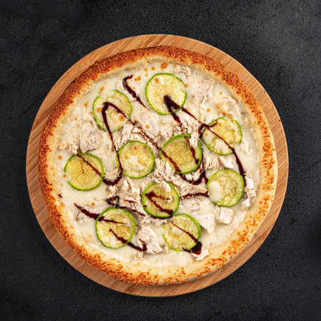 Chicken pizza with zucchini and balsamic sauceの写真素材