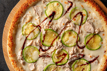 Closeup on chicken pizza with zucchiniの写真素材