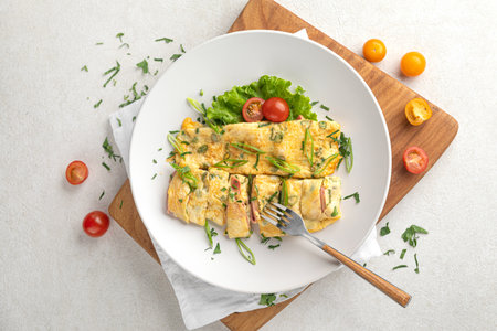 Portion of omelette breakfast with hamの写真素材