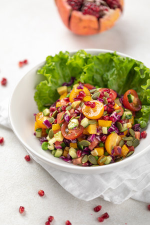 Portion of healthy fresh salad with tomatoesの写真素材