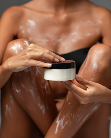 Woman applied with moisturizing lotion on bodyの写真素材