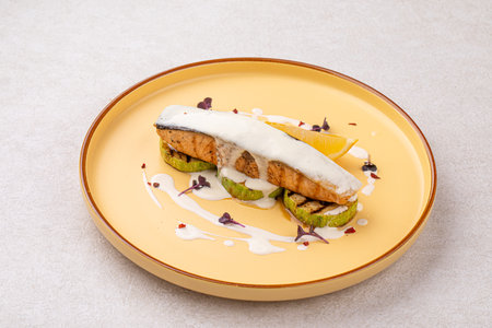 Portion of gourmet salmon steak on zucchiniの写真素材