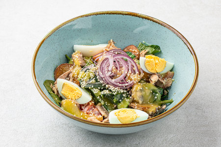 Portion of tuna salad with eggs and vegetablesの写真素材