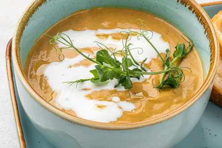 Portion of gourmet restaurant yellow pea soup