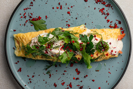 Portion of rolled omelette with salmonの写真素材