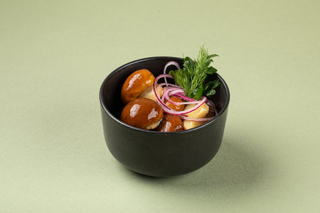 Portion of marinated pickled mushroomsの写真素材