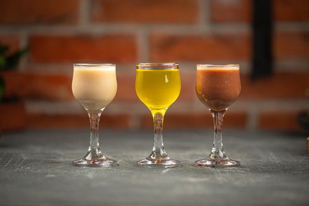 Glasses of assorted liquor on greyの写真素材