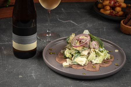 Salad with iceberg leaves and beef tongueの写真素材