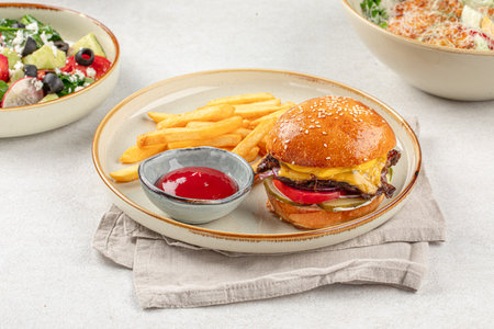 Portion of burger with french potato friesの写真素材