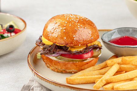 Portion of burger with french potato friesの写真素材