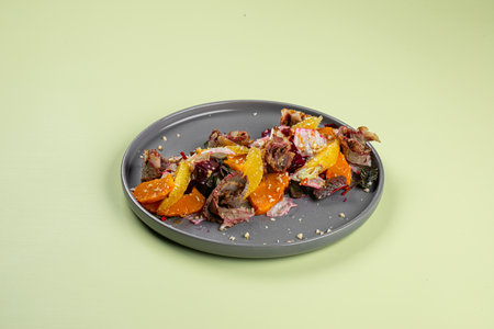 Portion of beef with pumpkin and beetsの写真素材