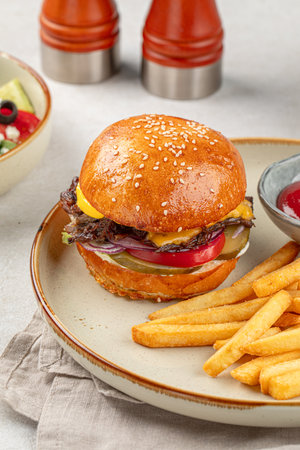 Portion of burger with french potato friesの写真素材