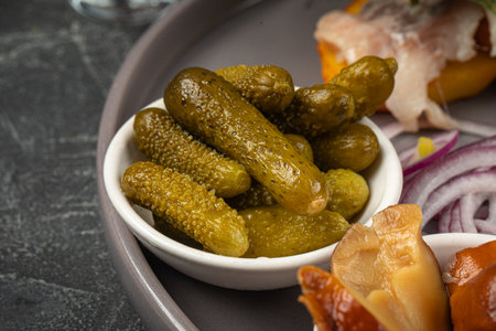 Pickled cucumbers in salty appetizer plateの写真素材