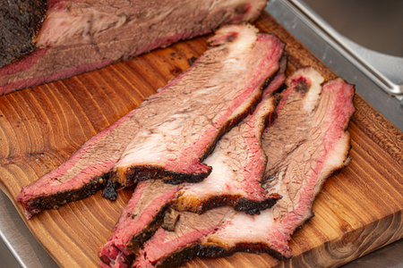 Sliced american beef brisket on a wooden boardの写真素材