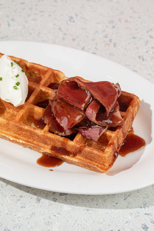 Portion of waffle with brisket and cream cheeseの写真素材