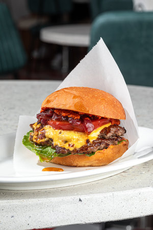 Portion of appetizing american cheeseburgerの写真素材