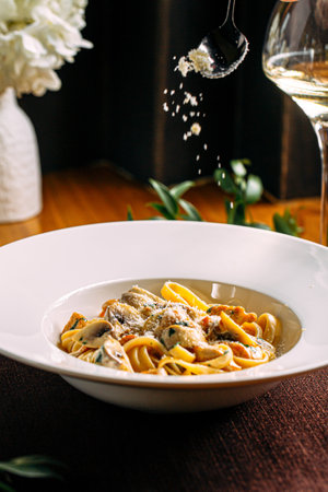 Portion of fettuccine alfredo pasta with chickenの写真素材