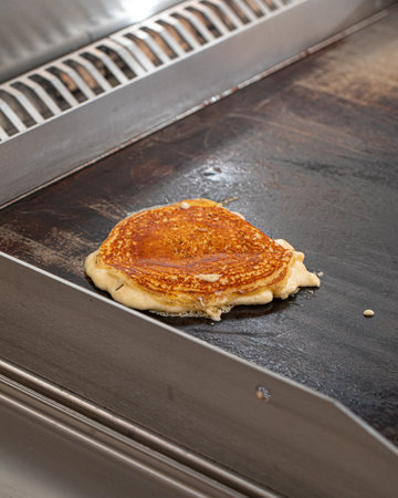 Pancake frying on the cafe panの写真素材