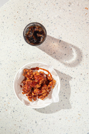 Crispy fried chicken thighs with drinkの写真素材