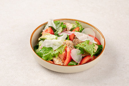 Portion of vegetables salad with chickenの写真素材